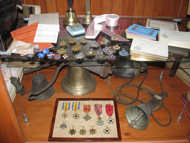Bell, medals and school keepsakes